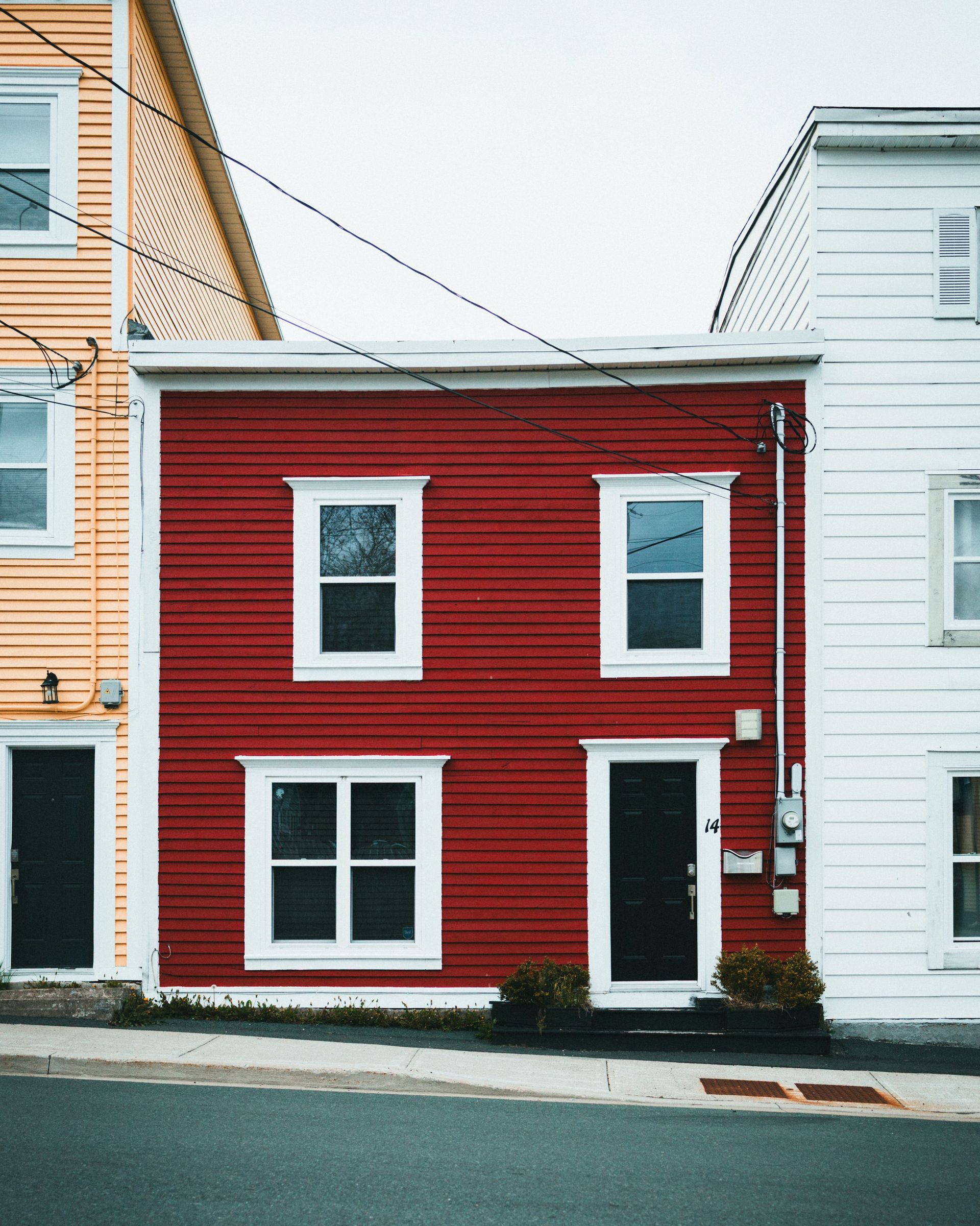 Brightly painted row houses create a vibrant urban streetscape.
